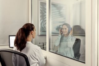 Woman getting a hearing exam