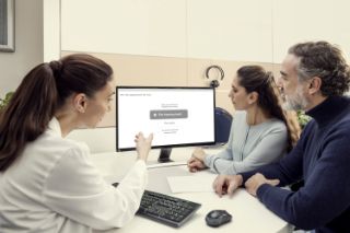 Provider explaining hearing test results to couple