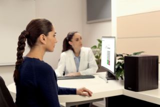 A senior woman during an appointment with an Amplifon hearing professional