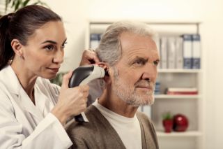 Man undergoing tympanometry