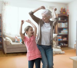 Grandma and grandaughter dancing