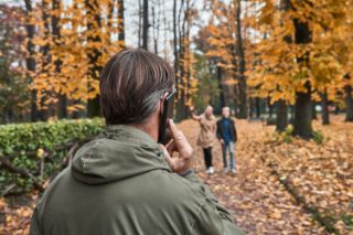 Man on phone wearing hearing aid