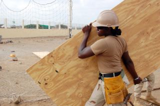 Construction woman with board