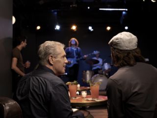 Man with hearing aid at concert