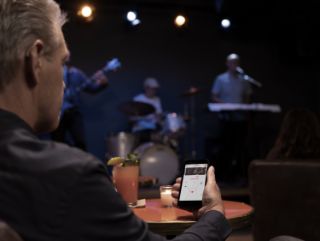 Man using mobile phone at a concert