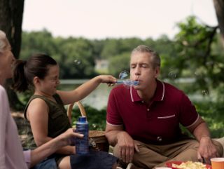Grandpa and grandchild at picnic