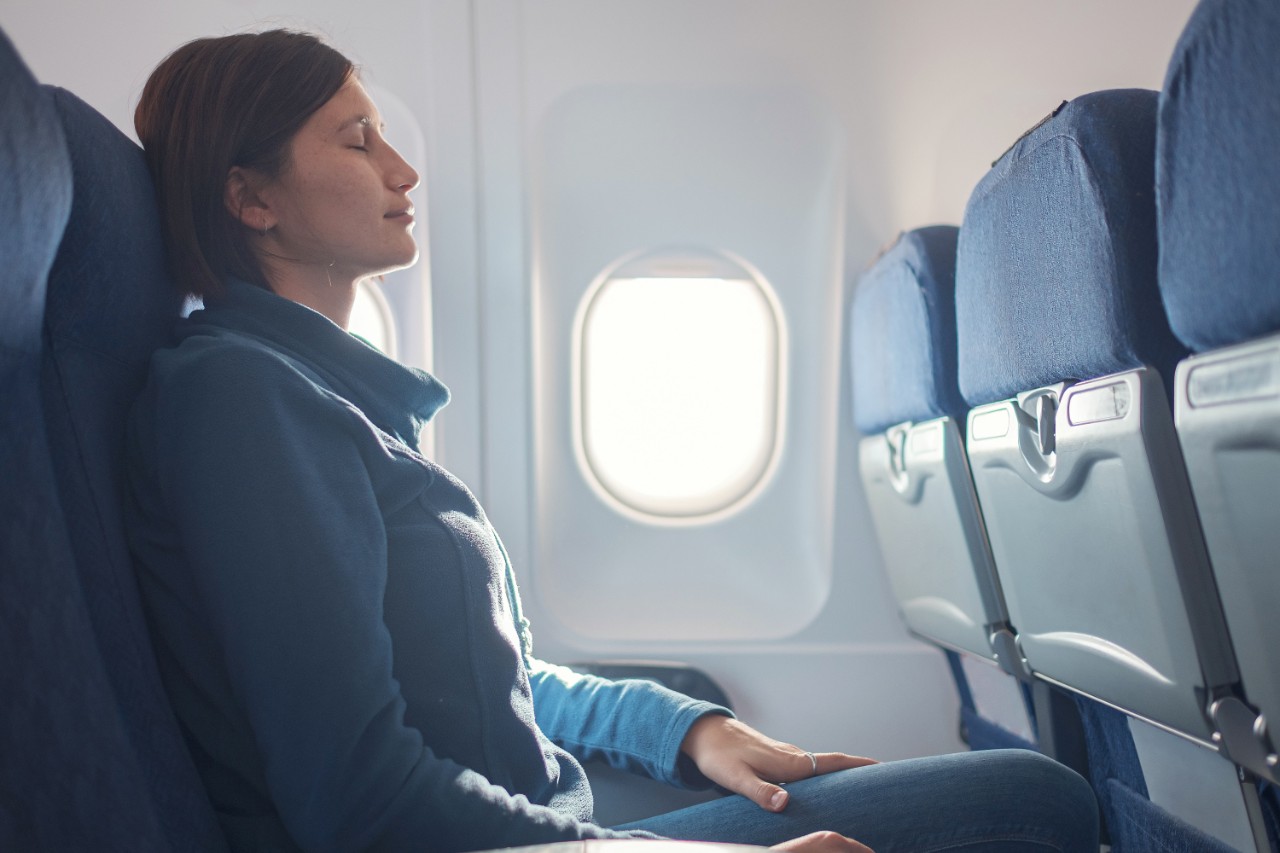 Profile woman on airplane