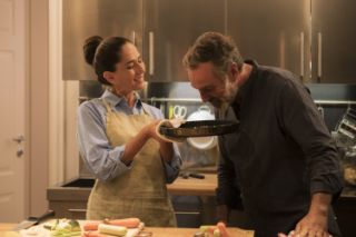 A senior couple cooking together in their kitchen