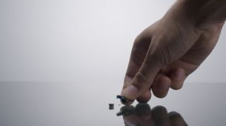 Hearing aid with hearing aid battery next to it