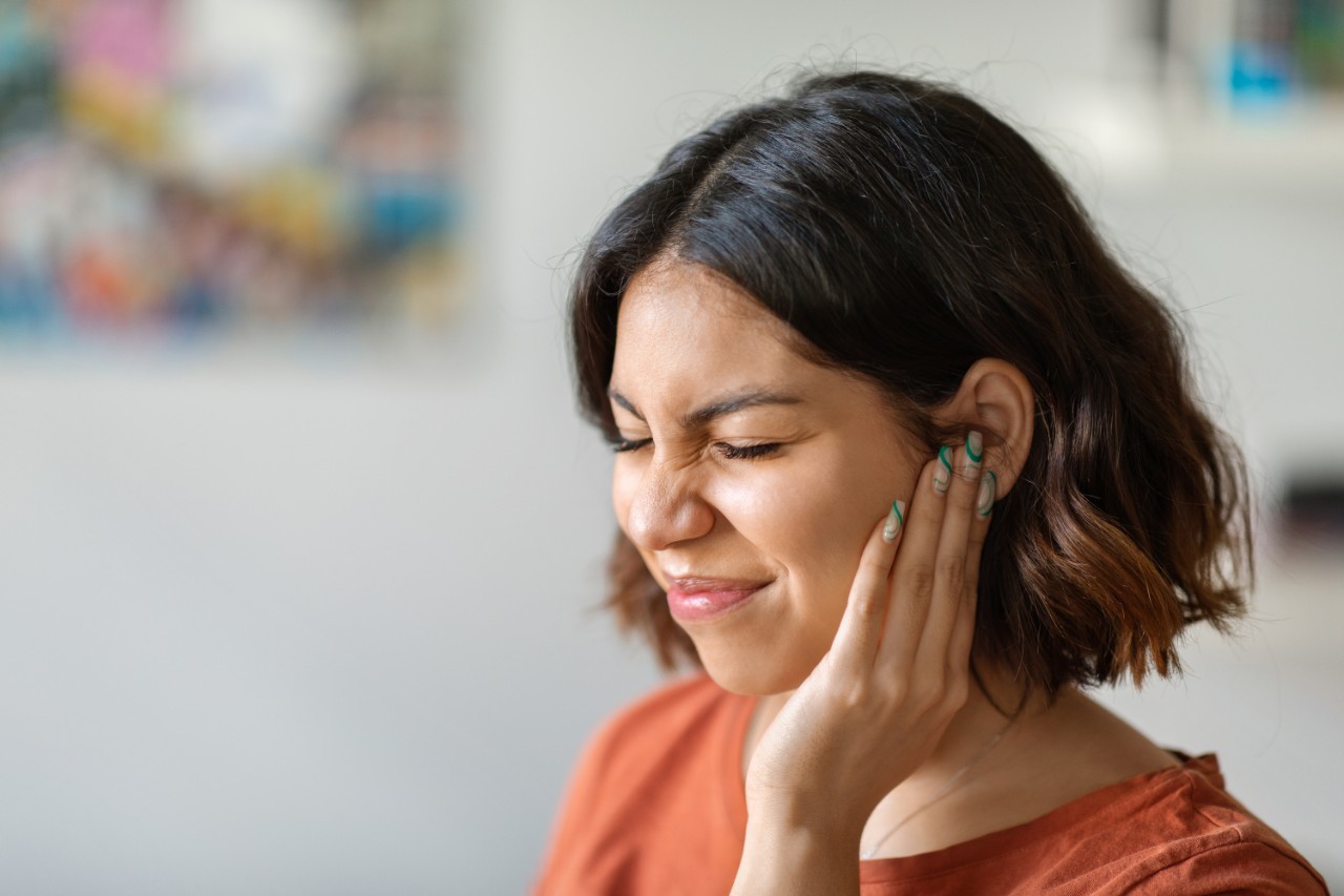 Woman with ear pain