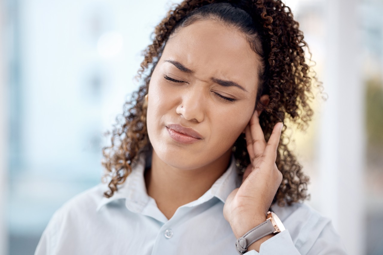 Woman with ear pain