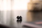 Two hearing aids on a table