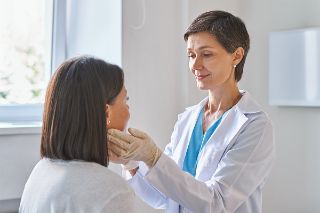 A doctor visiting a patient