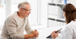 A man and a doctor at a hearing appointment