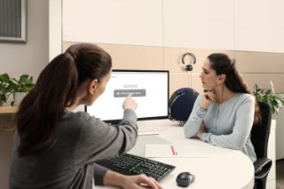 A woman at a hearing appointment