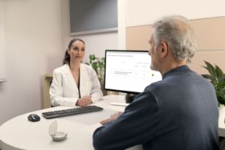 A hearing professional talking to a client
