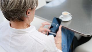 A man watching his mobile phone