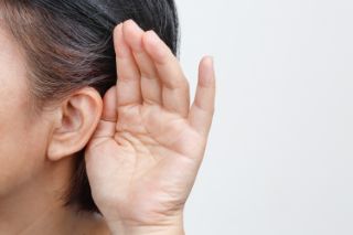 A ear shown, indicating hearing loss