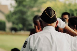 Veteran in uniform seen from behind